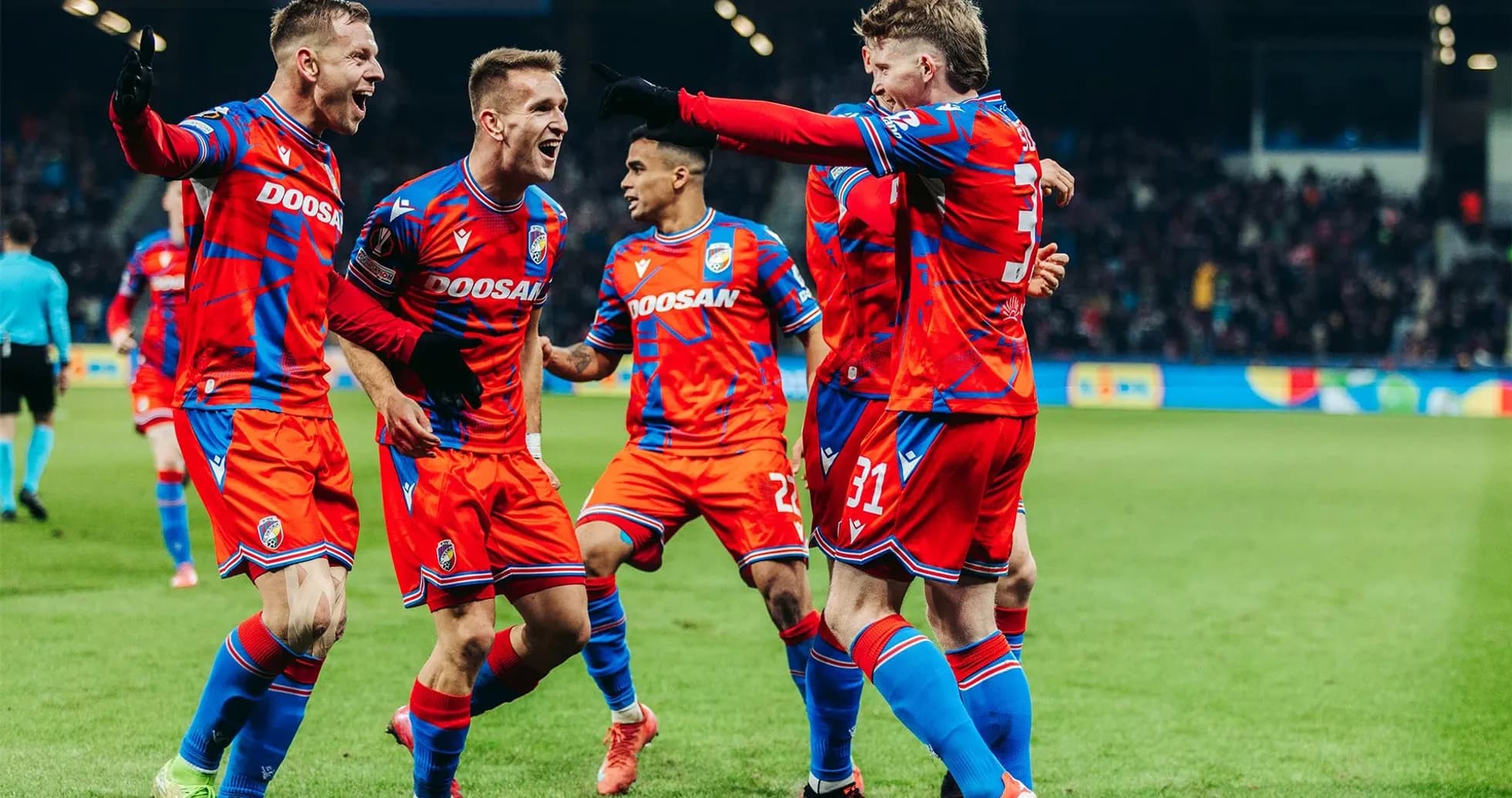 Players celebrating a goal during UEFA match Players celebrating a goal during UEFA match