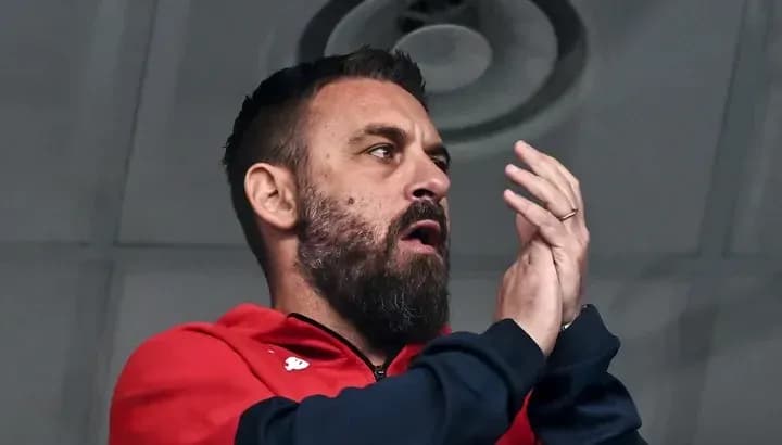 Man in red jacket clapping enthusiastically Man in red jacket clapping enthusiastically
