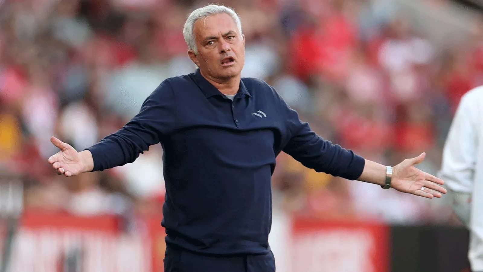 Coach gesturing during a match on the sidelines Coach gesturing during a match on the sidelines