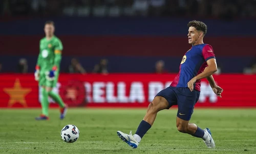 Player kicking ball during football match action Player kicking ball during football match action