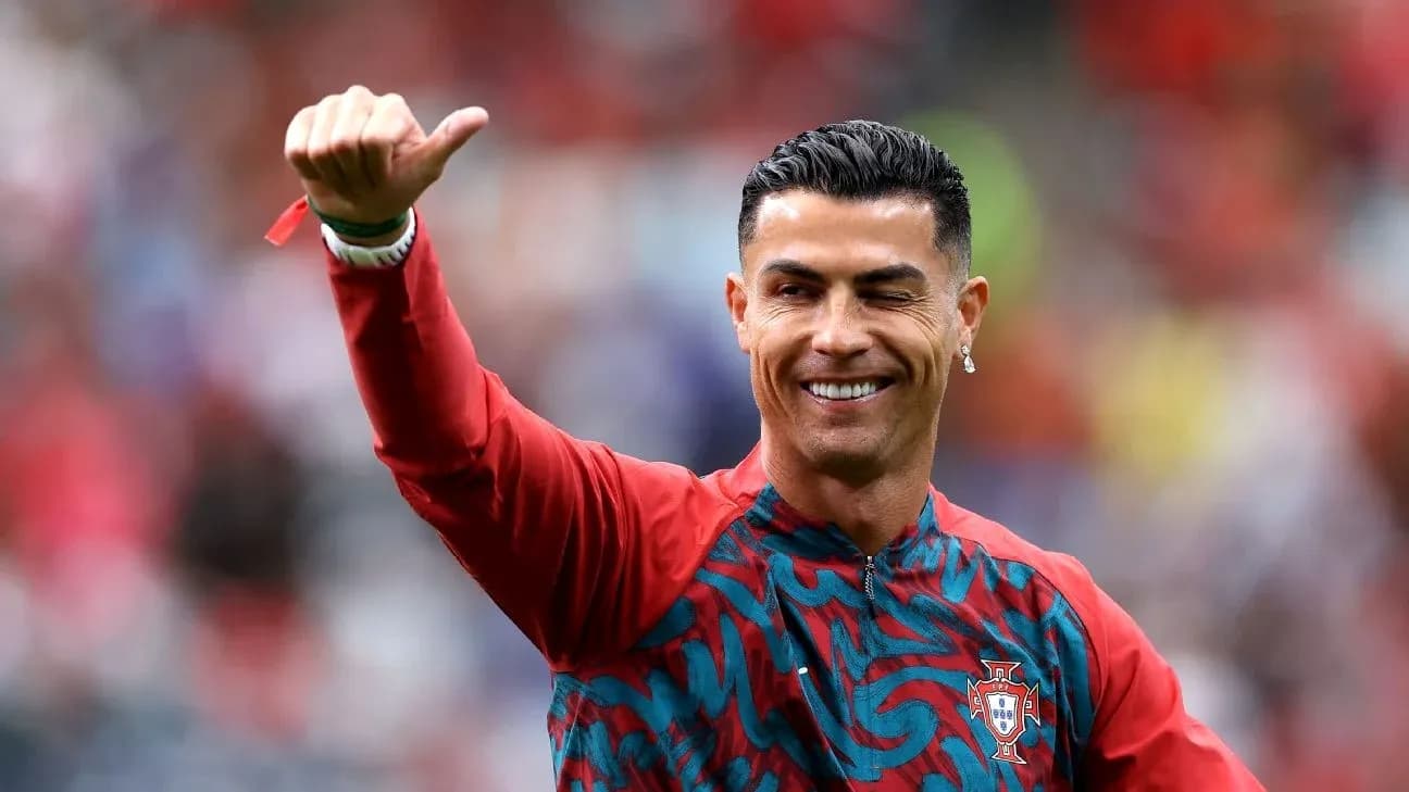 Player waving during warm-up in Portugal kit Player waving during warm-up in Portugal kit