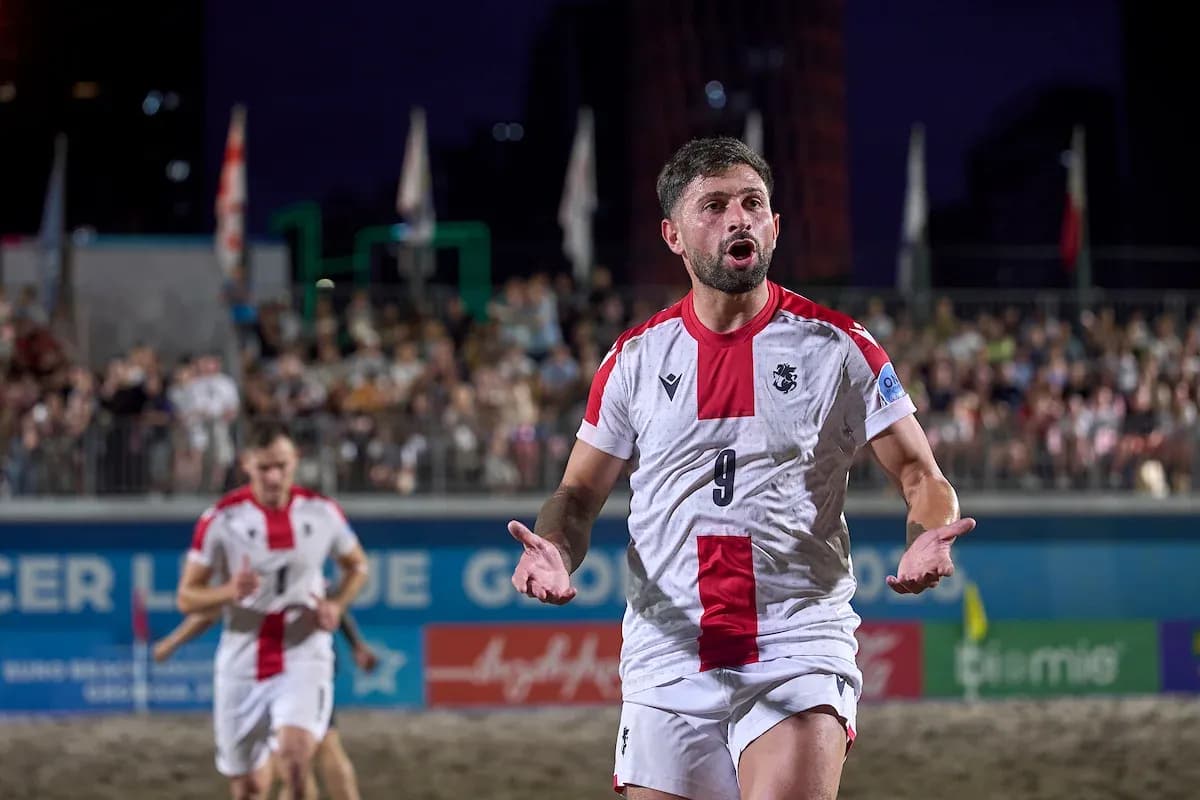 Player celebrating on beach soccer field during match Player celebrating on beach soccer field during match