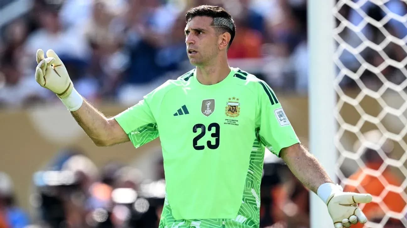 Goalkeeper in green kit directing play on field Goalkeeper in green kit directing play on field