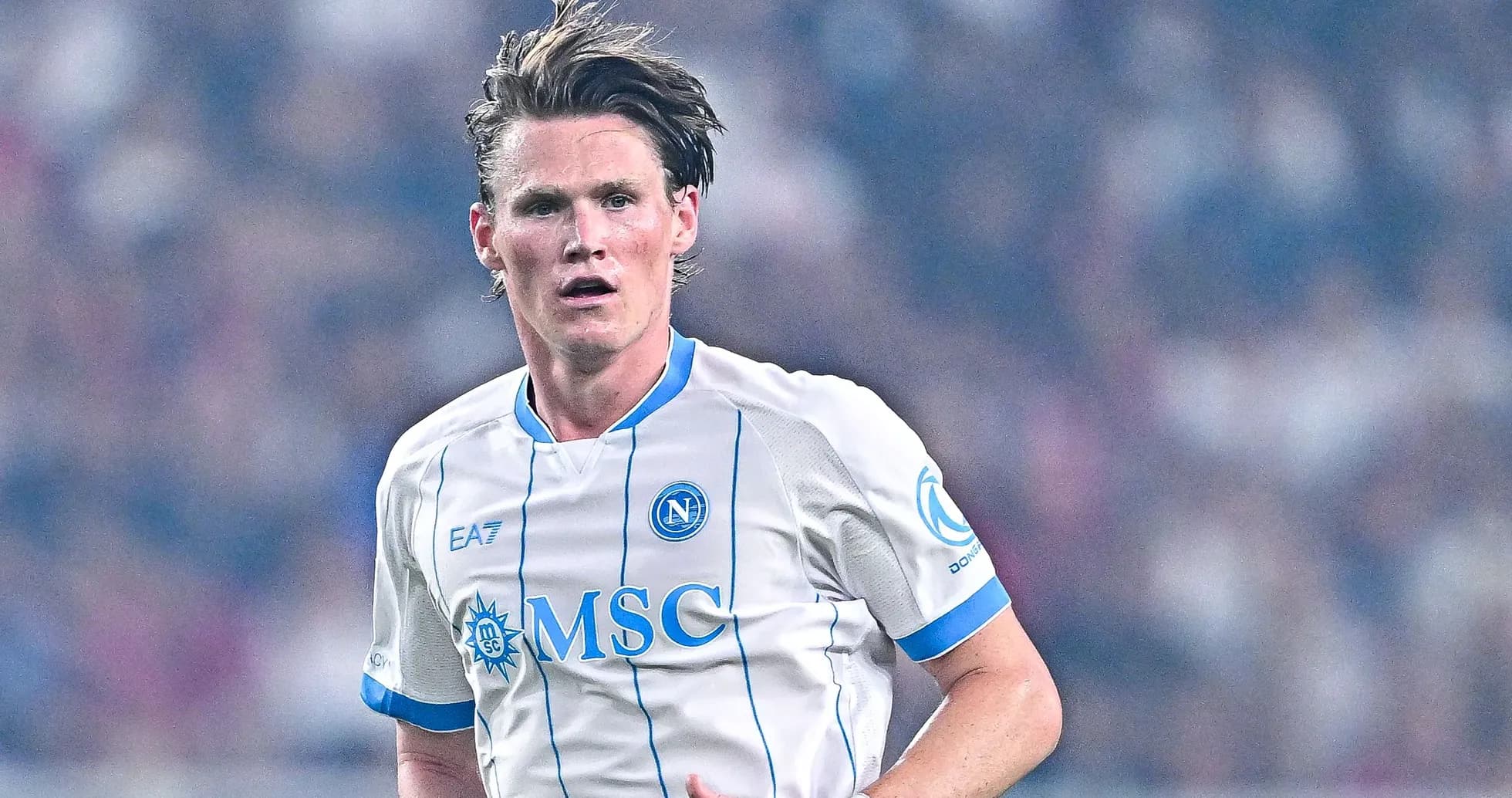 Player in Napoli jersey running on the pitch Player in Napoli jersey running on the pitch