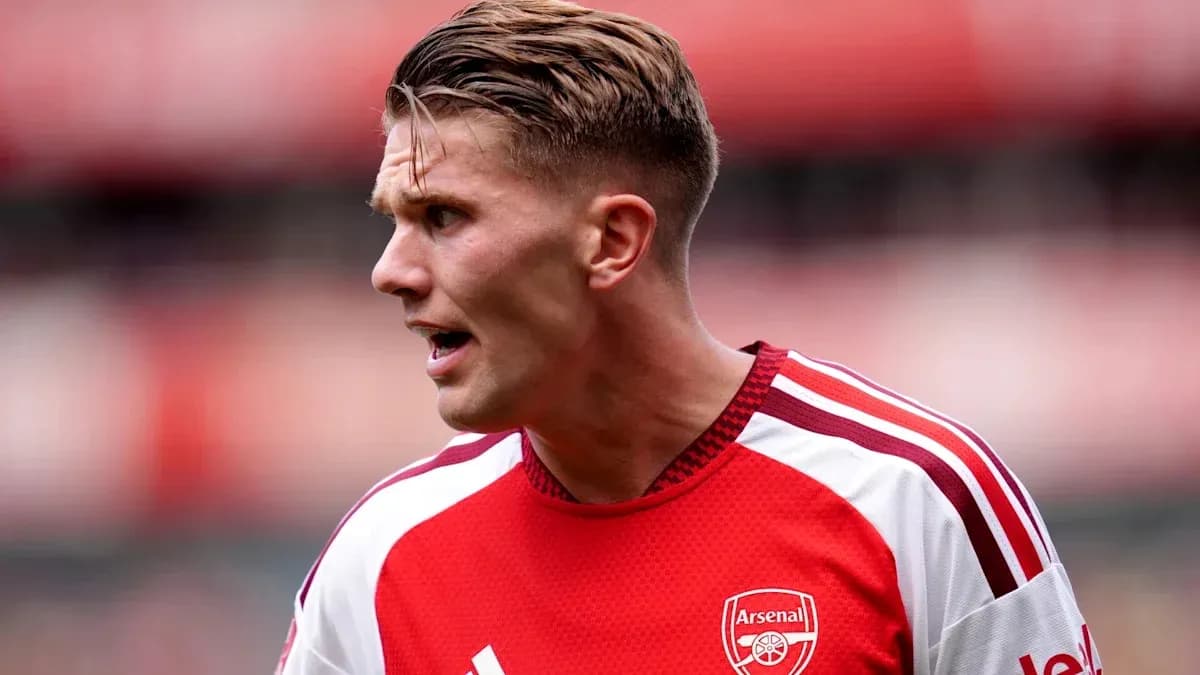Player wearing Arsenal jersey during match action Player wearing Arsenal jersey during match action