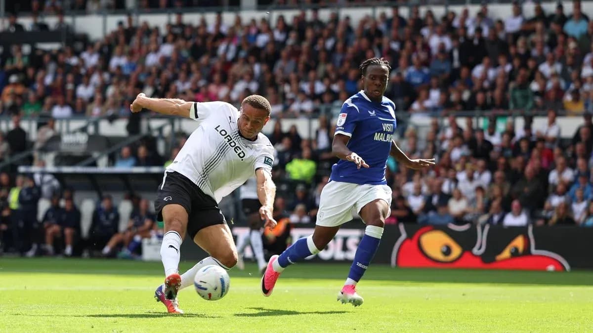 Player from Derby County kicking ball during match Player from Derby County kicking ball during match