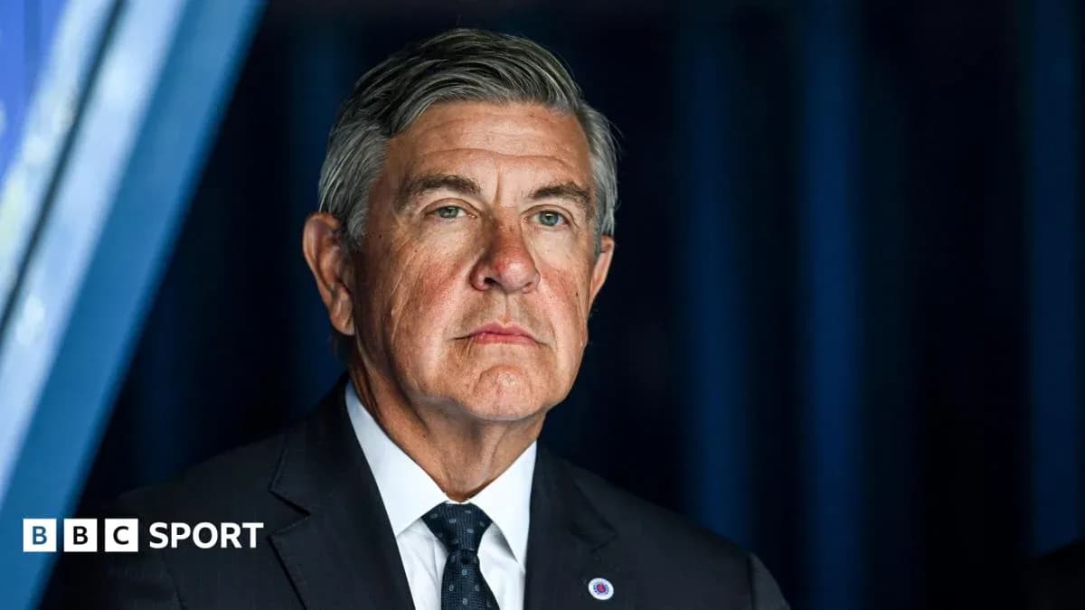 Man in suit during a sports event Man in suit during a sports event