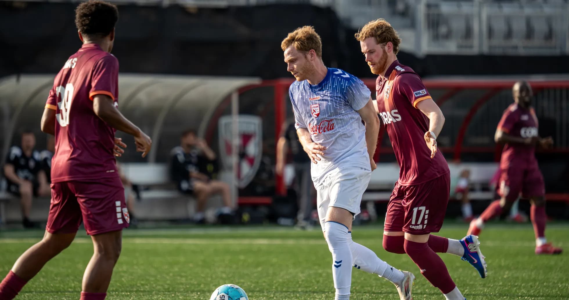 Players competing for the ball in USL match Players competing for the ball in USL match