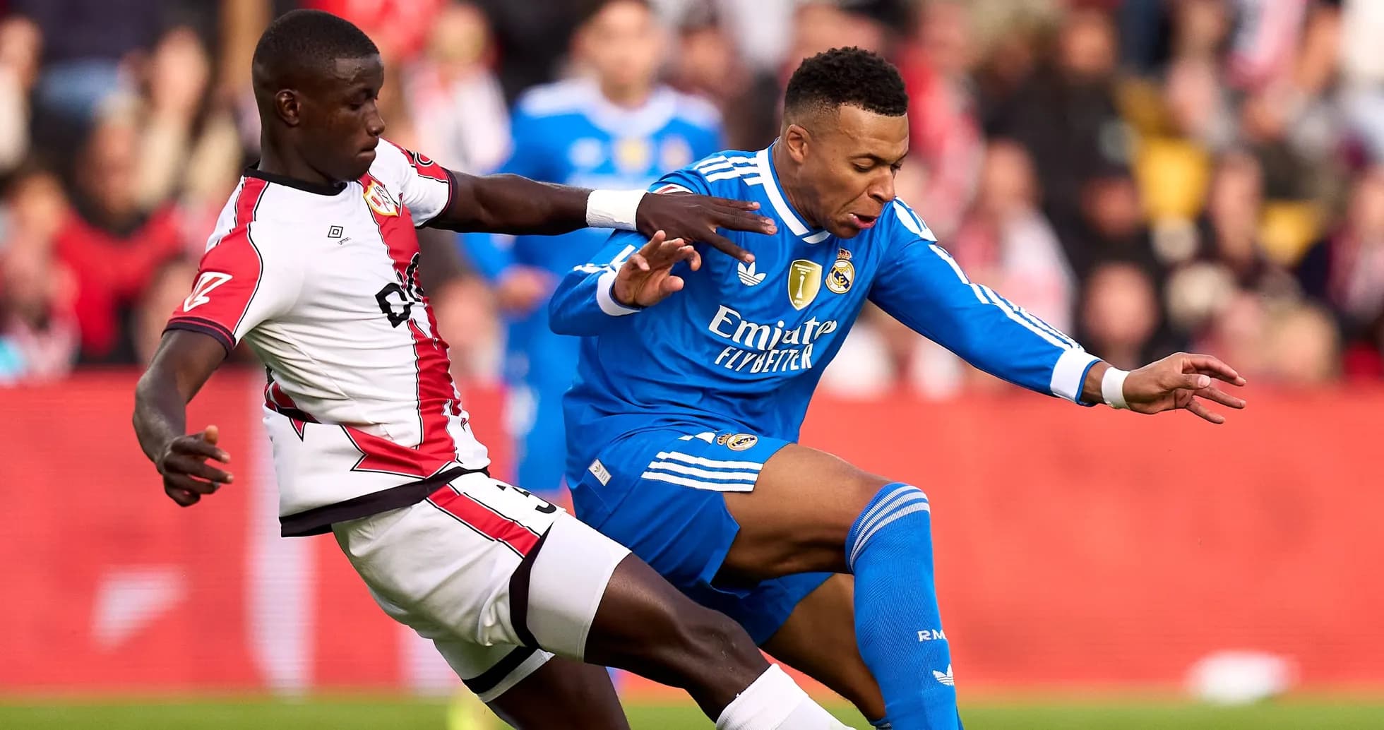 Player from Southampton tackling Real Madrid player Player from Southampton tackling Real Madrid player