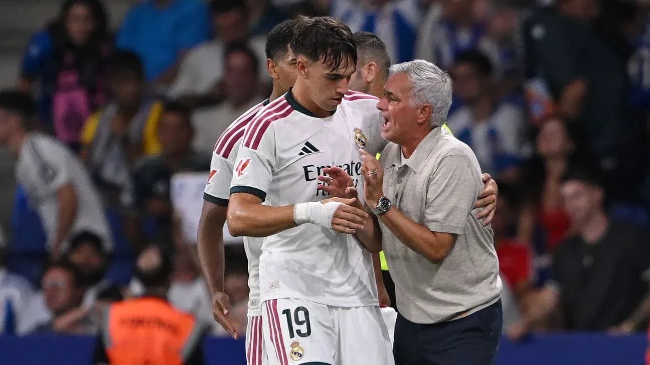 Coach speaking with player during match on sidelines Coach speaking with player during match on sidelines