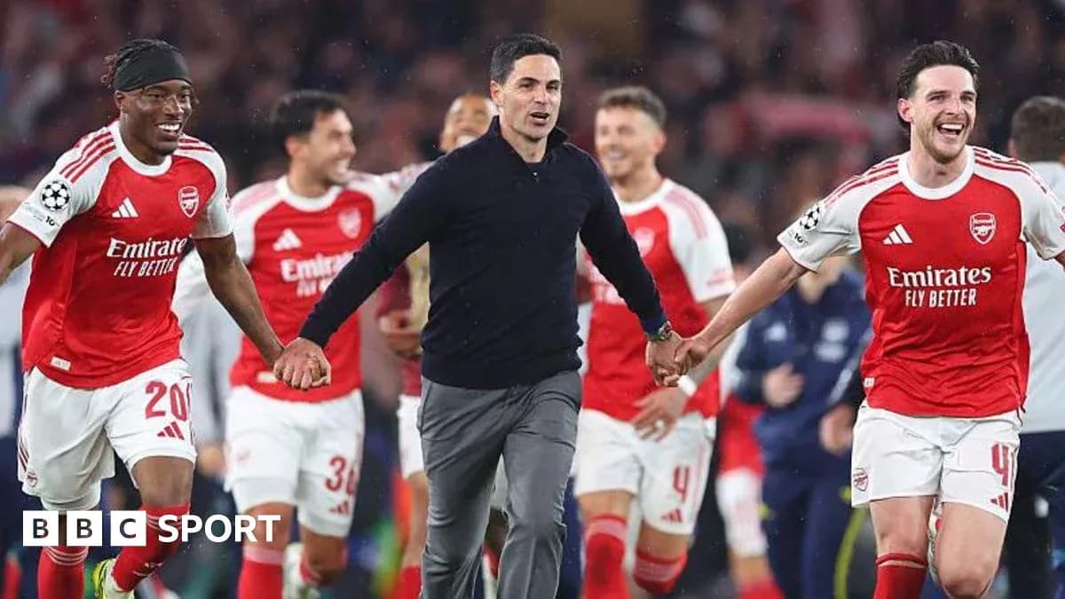 Arsenal players celebrating with their manager after victory Arsenal players celebrating with their manager after victory