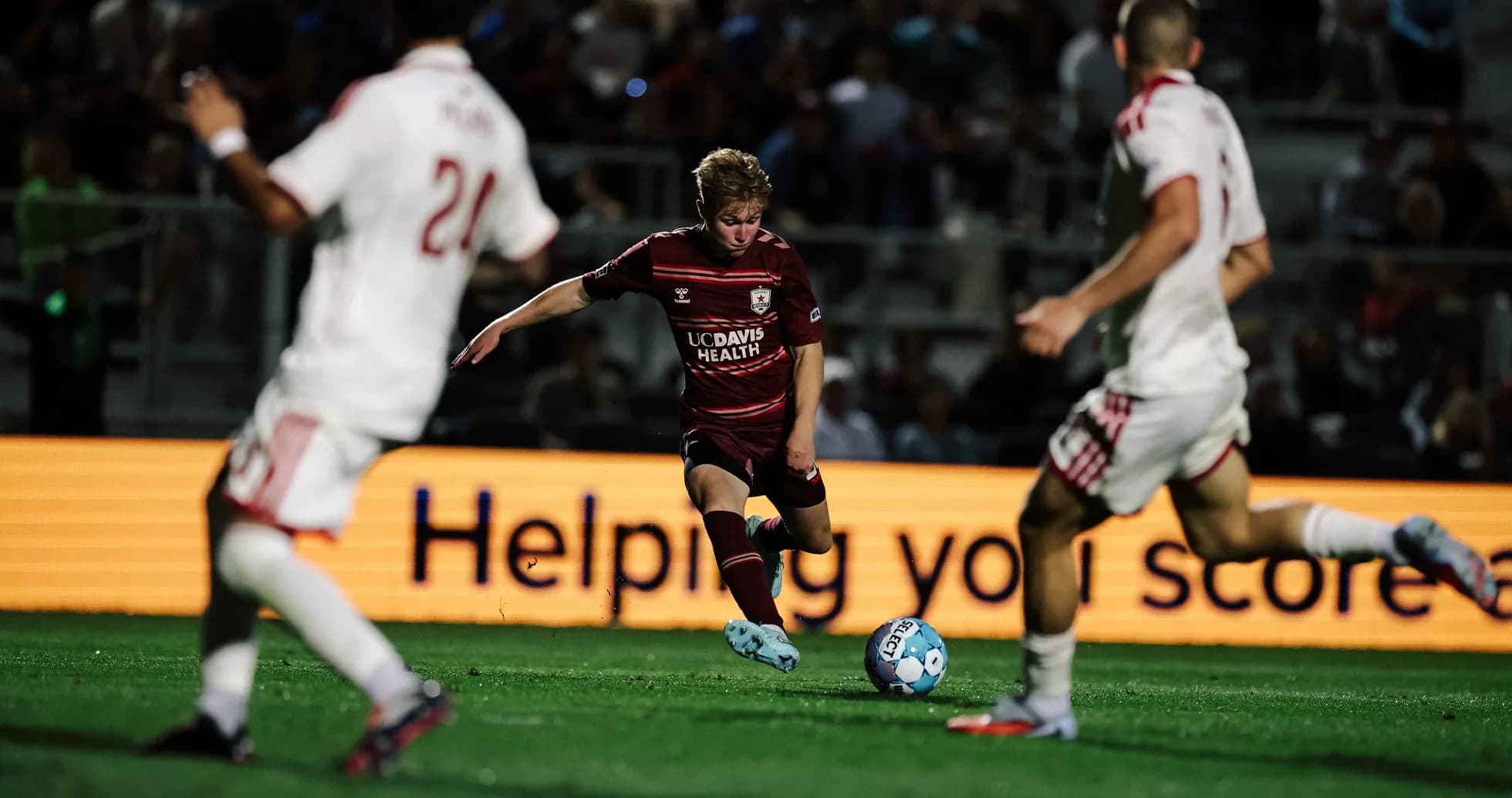 Player dribbling the ball during match Player dribbling the ball during match