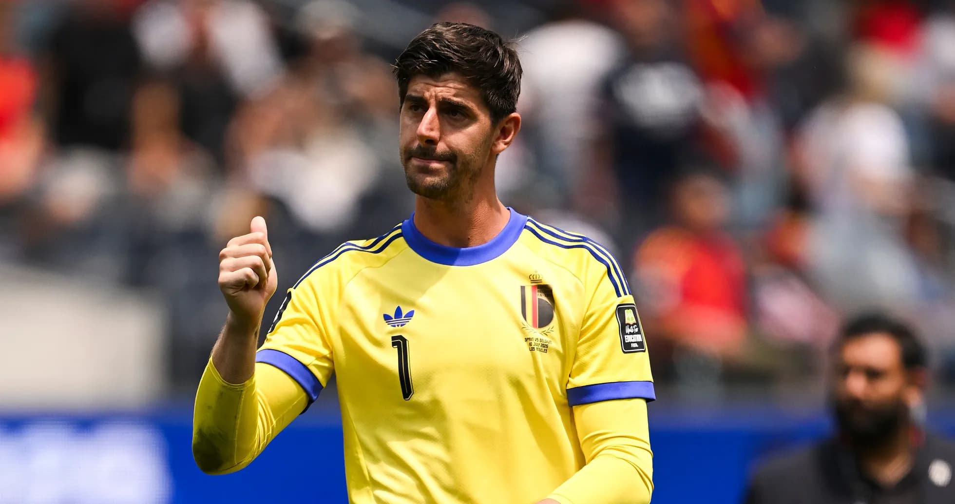 Goalkeeper in yellow jersey signaling during match Goalkeeper in yellow jersey signaling during match