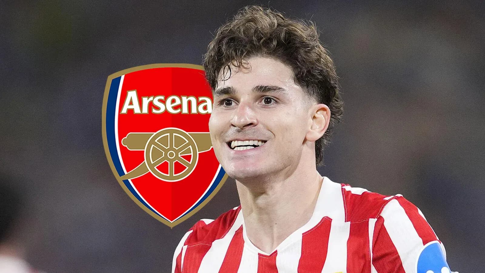Player celebrating with Arsenal logo in background Player celebrating with Arsenal logo in background