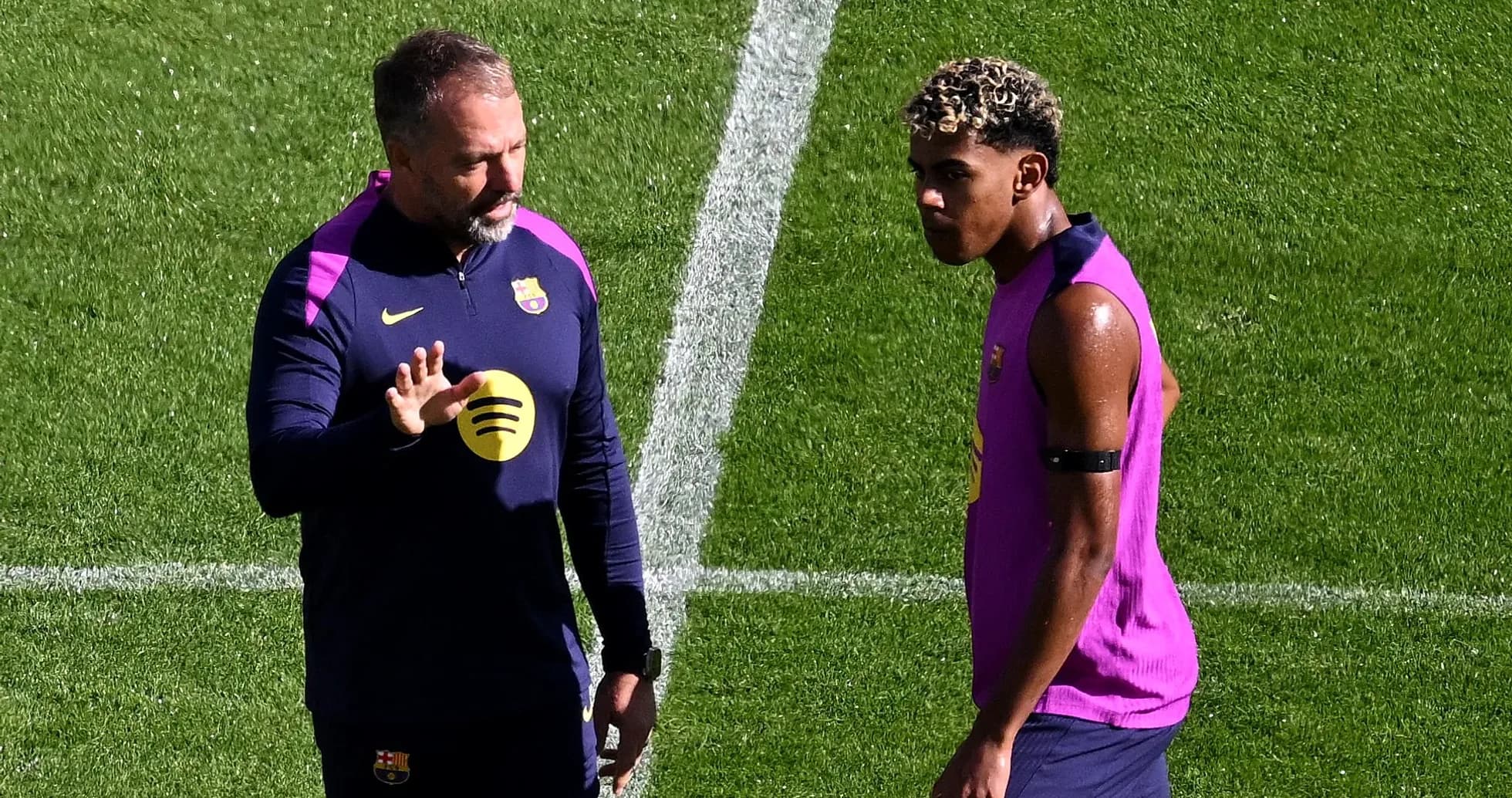 Coach speaking with player during training session Coach speaking with player during training session