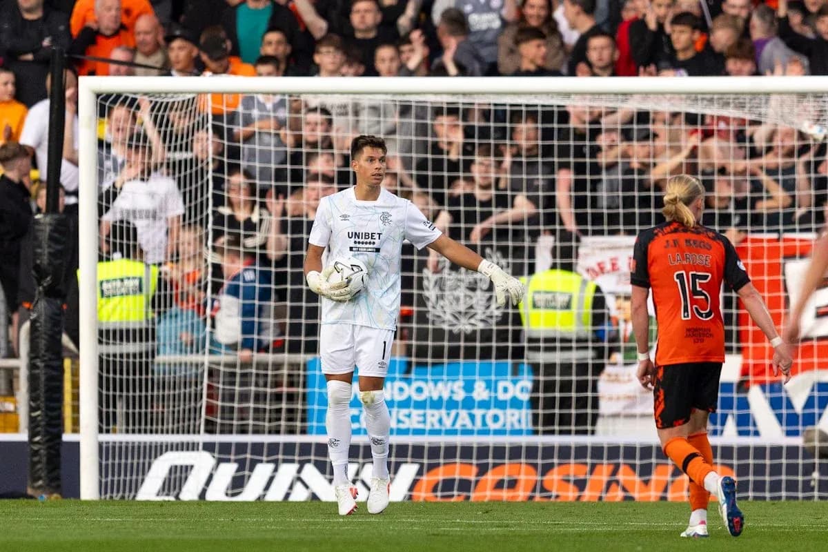 Goalkeeper in action during a tense match moment Goalkeeper in action during a tense match moment
