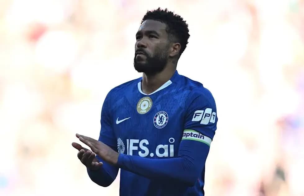 Player in blue jersey clapping during match Player in blue jersey clapping during match