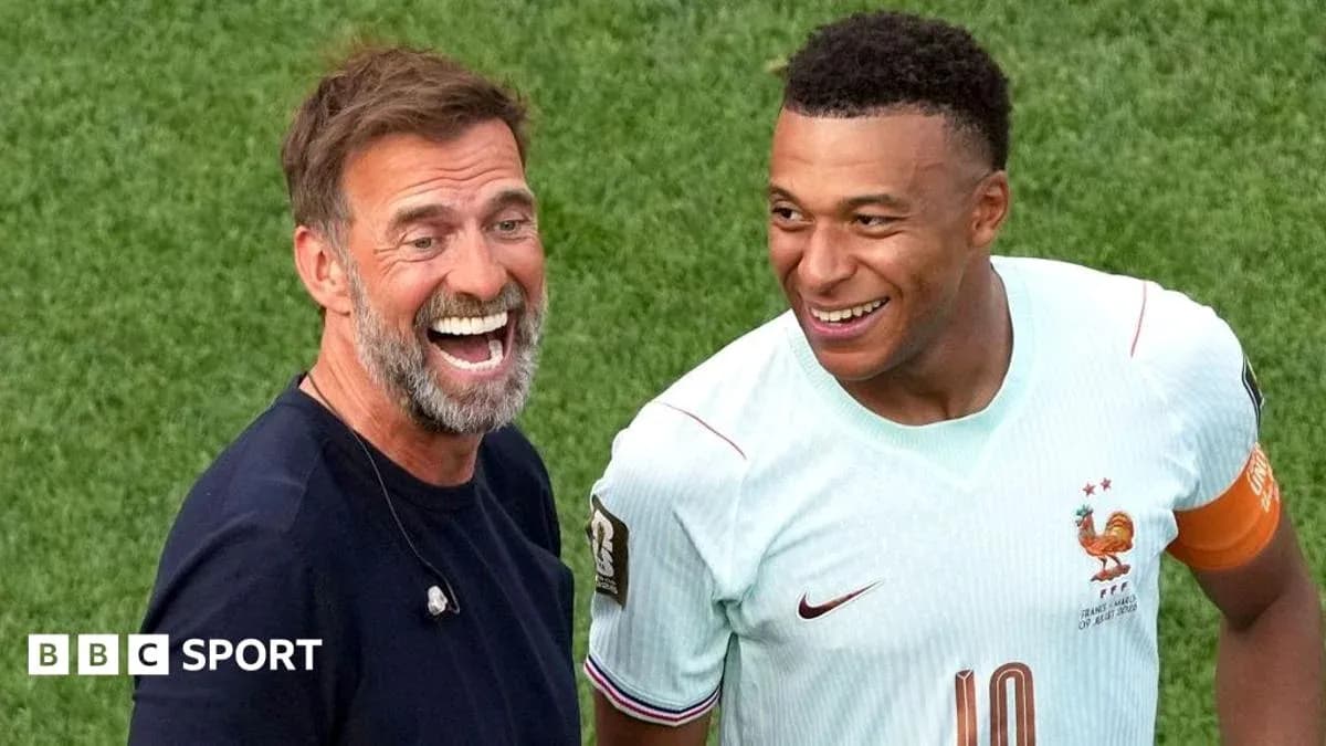 Manager and player smiling during match interaction Manager and player smiling during match interaction