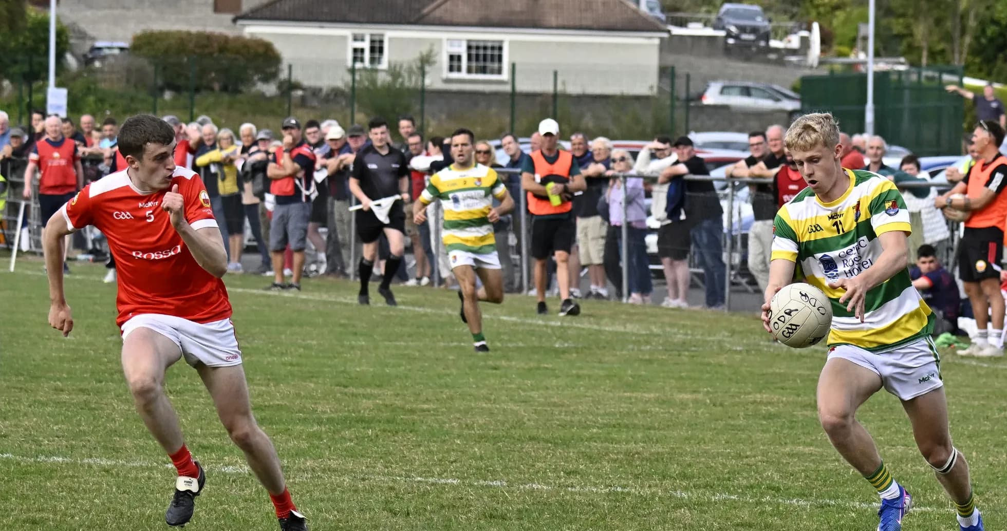 Player in green and yellow receiving ball during match Player in green and yellow receiving ball during match