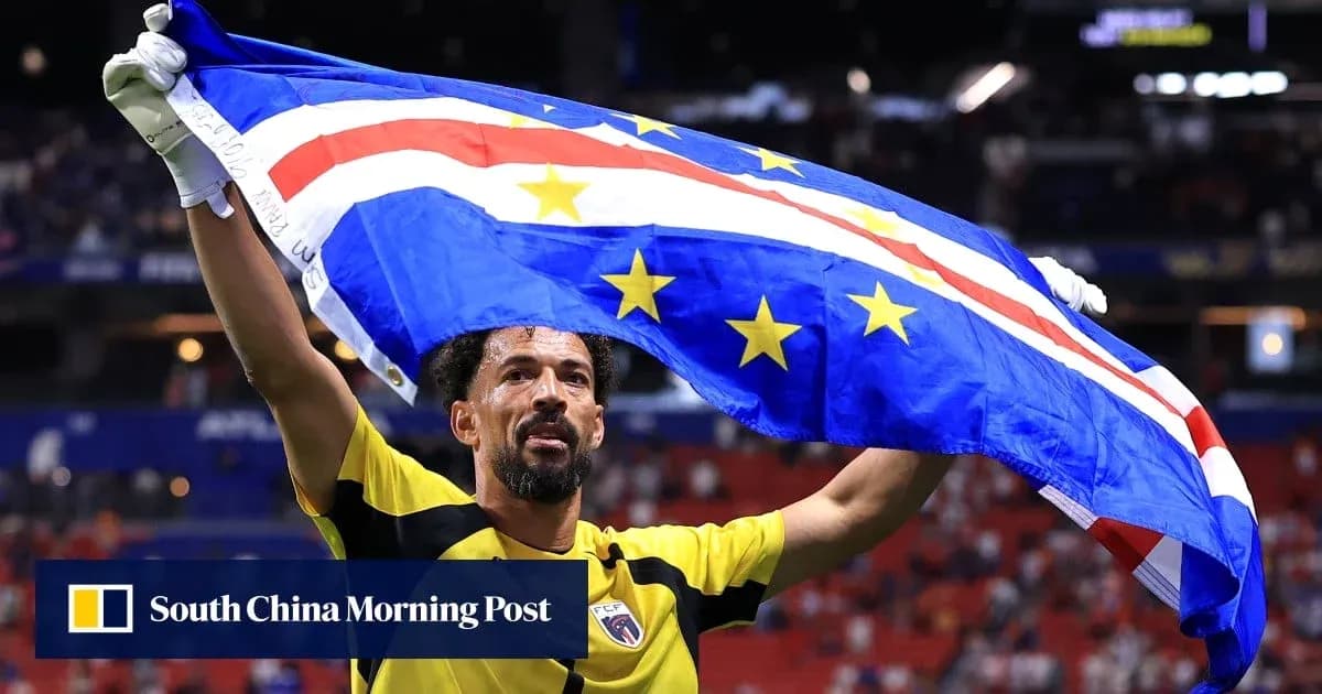 Goalkeeper celebrating with national flag after match Goalkeeper celebrating with national flag after match