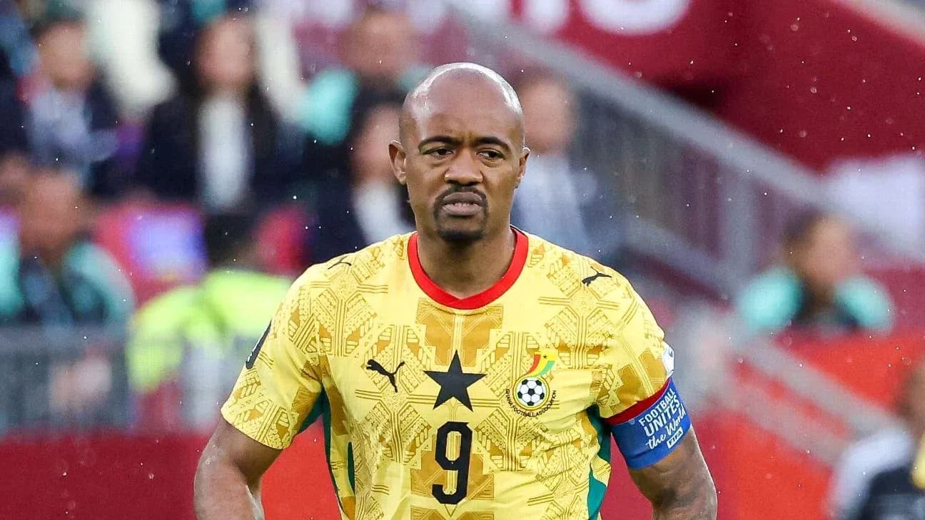 Ghanaian player wearing yellow jersey on the field Ghanaian player wearing yellow jersey on the field