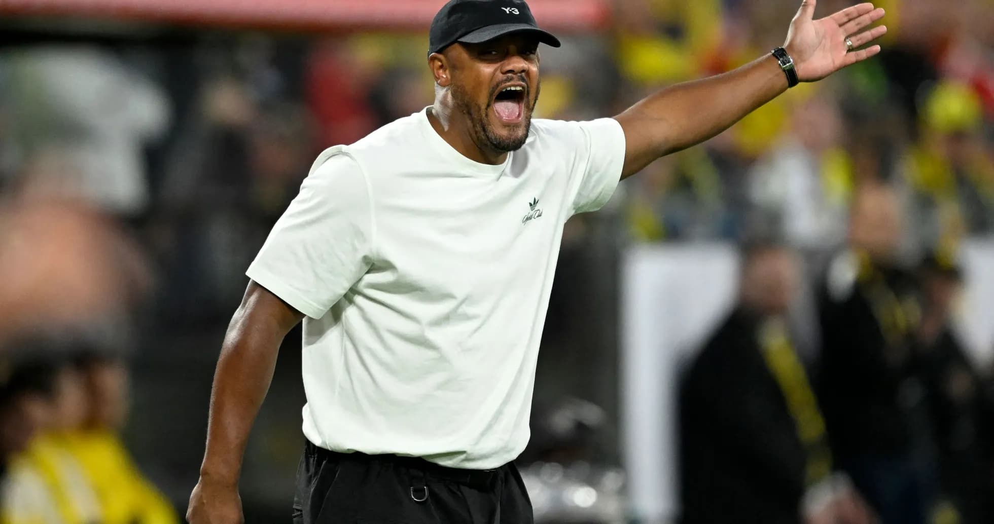 Coach gesturing during a match from the sideline Coach gesturing during a match from the sideline