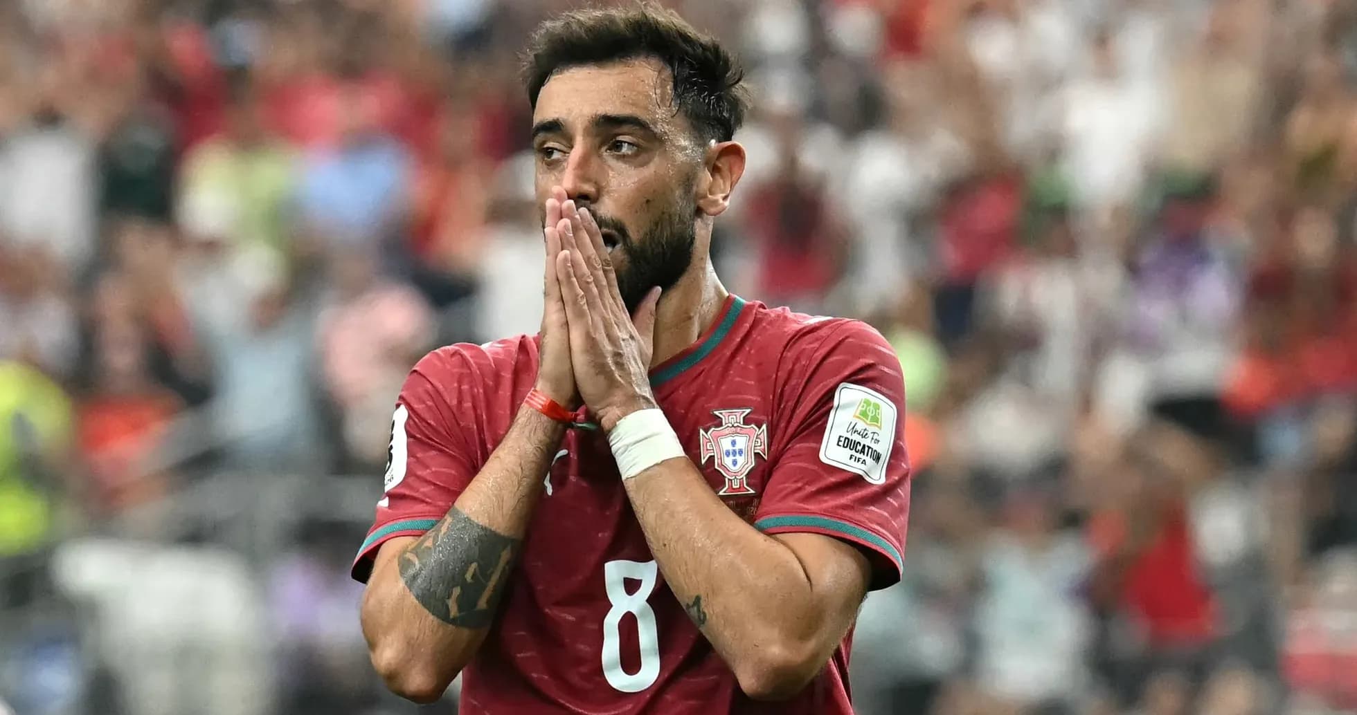Player in Portugal jersey with hands clasped in front Player in Portugal jersey with hands clasped in front