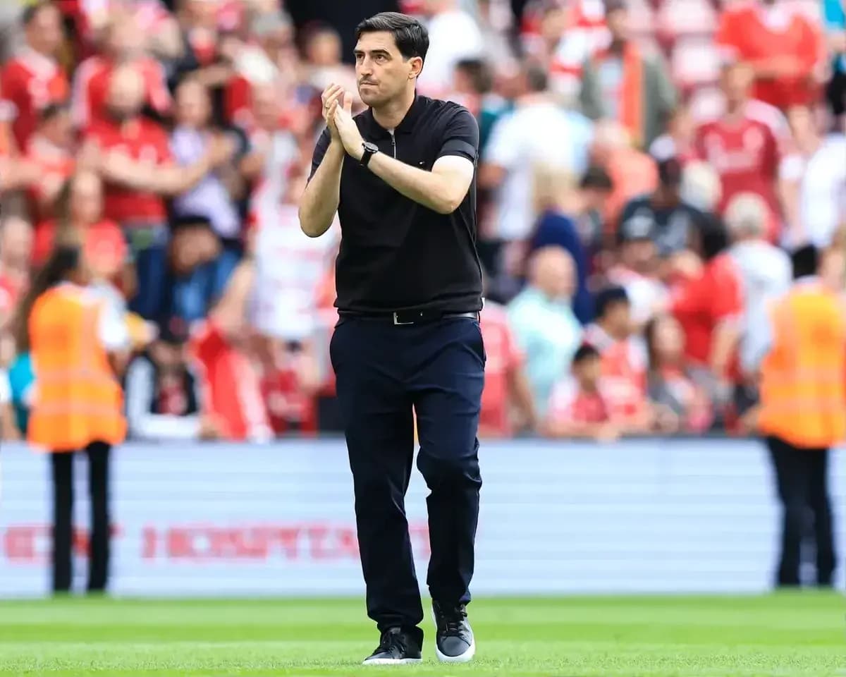 Coach applauding fans on the field after match Coach applauding fans on the field after match