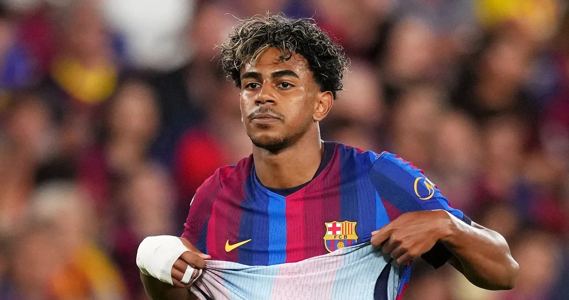 Player pulling up Barcelona jersey during match Player pulling up Barcelona jersey during match