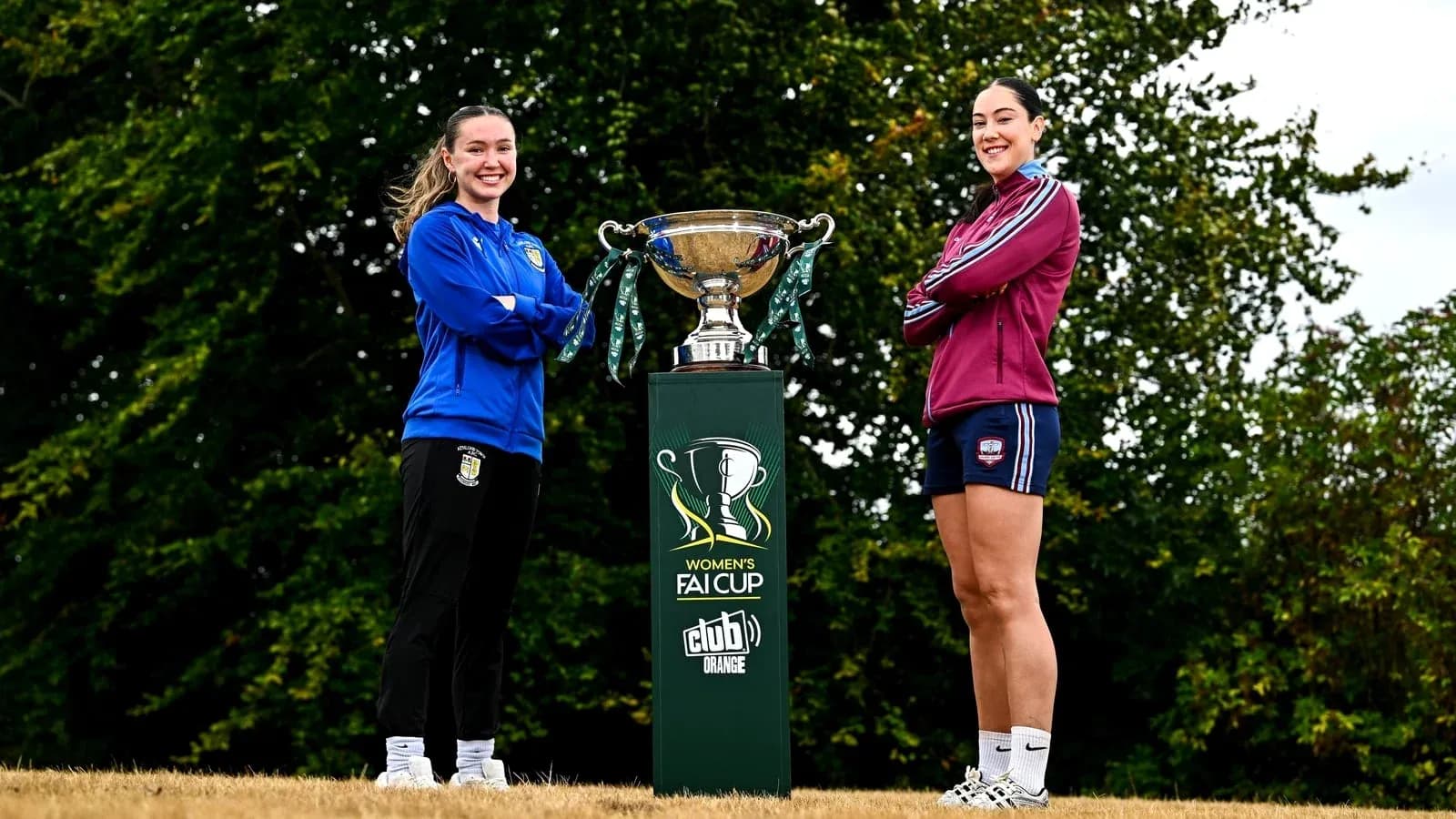 Two players posing with Women's FAI Cup trophy Two players posing with Women's FAI Cup trophy