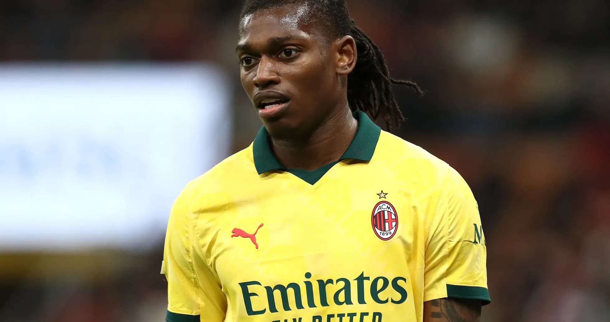 Player in yellow AC Milan jersey during match Player in yellow AC Milan jersey during match