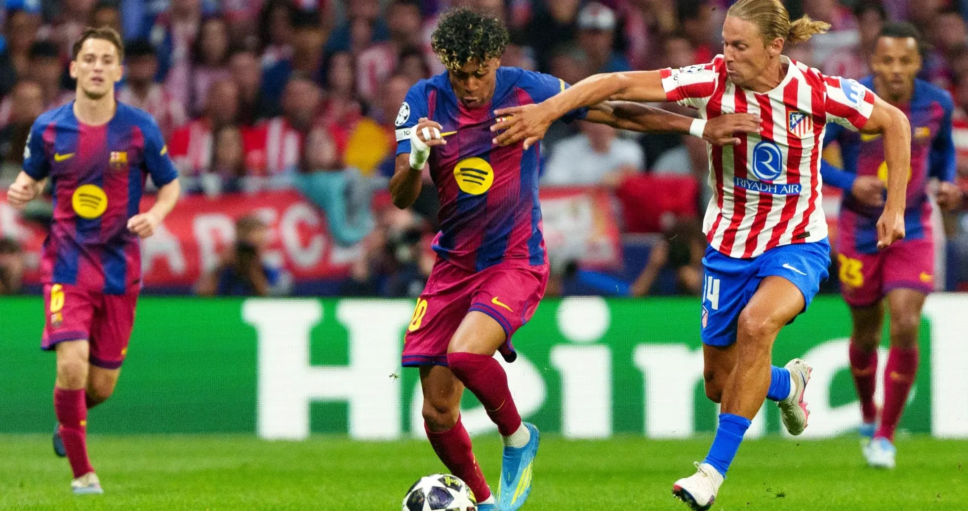 Barcelona player dribbling against Atletico Madrid defender Barcelona player dribbling against Atletico Madrid defender