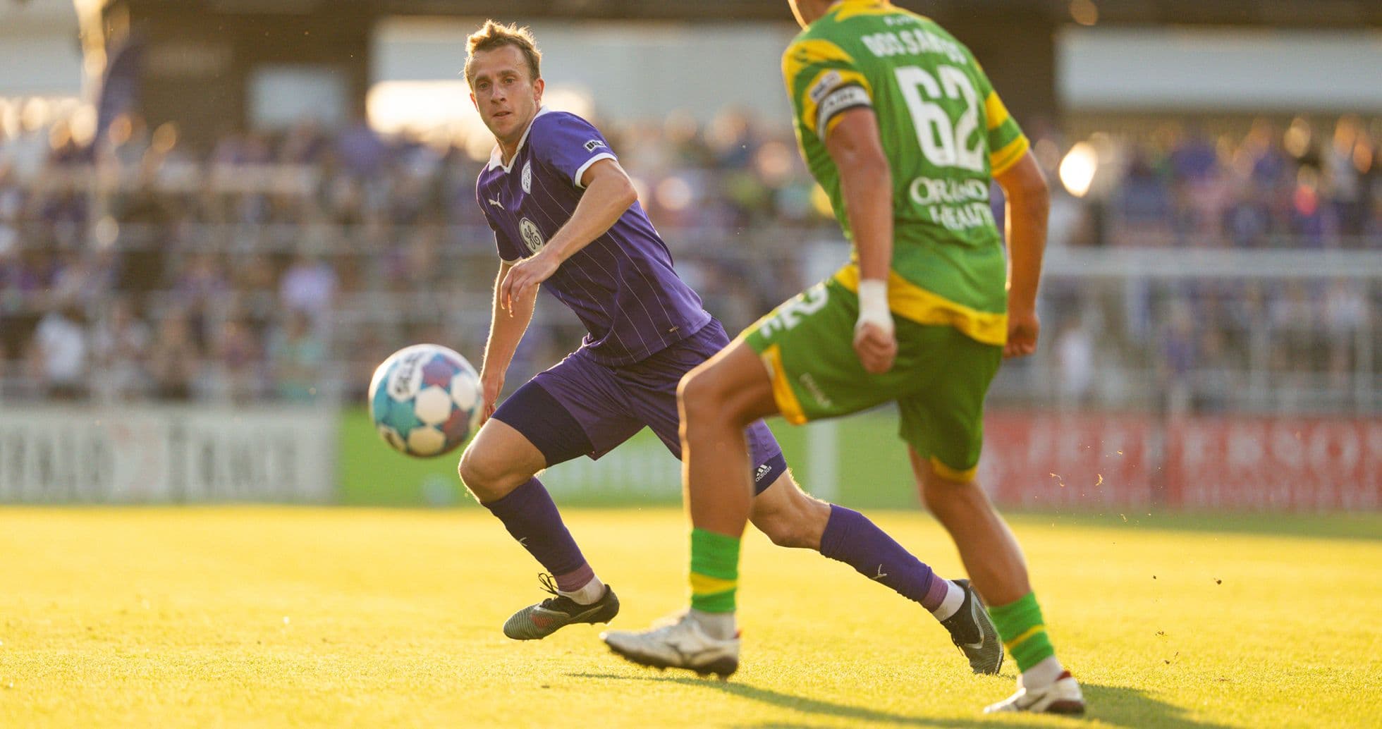 Player passing ball during Louisville City match Player passing ball during Louisville City match