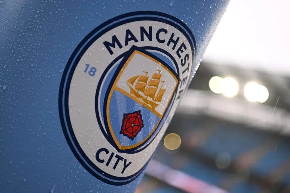 Close-up of Manchester City club badge with raindrops Close-up of Manchester City club badge with raindrops