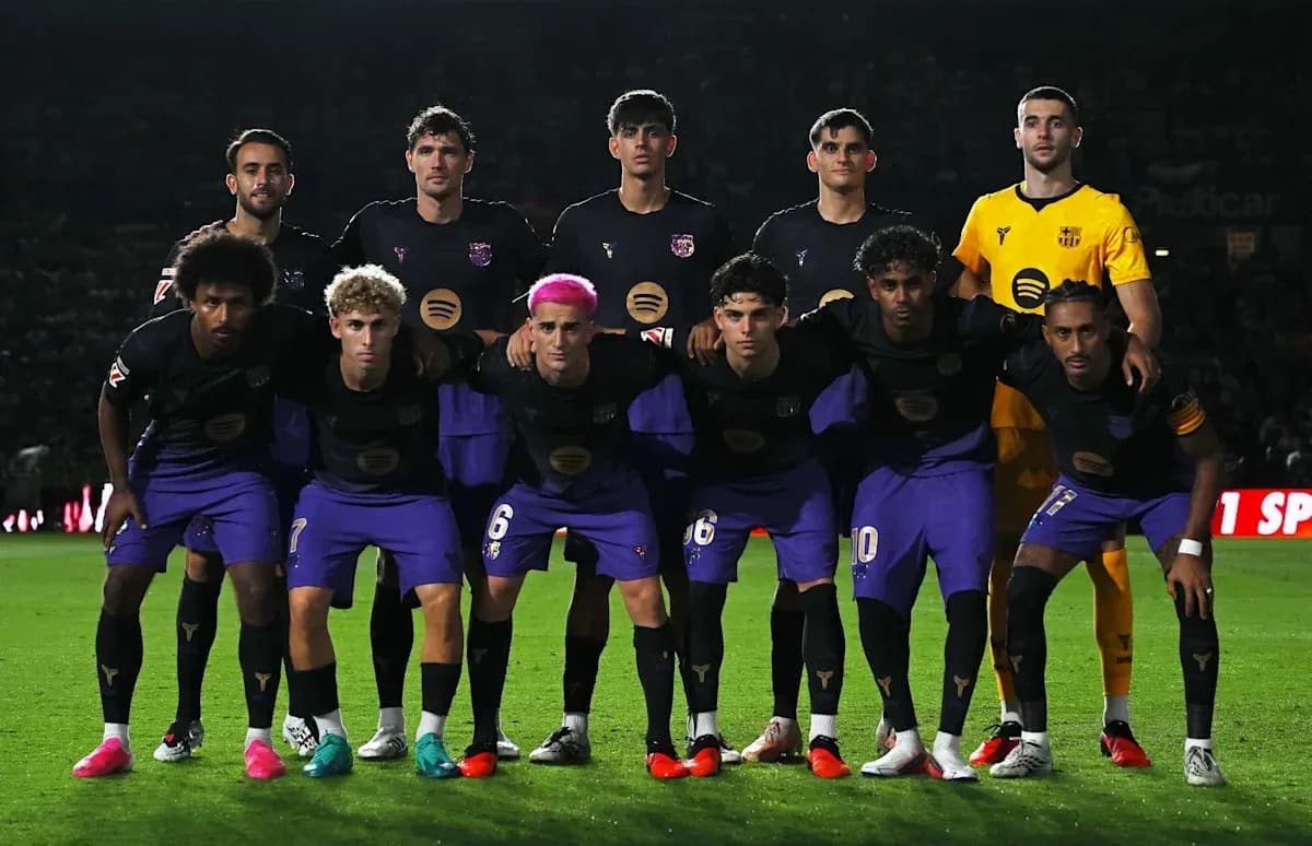 Football team posing for a group photo before match Football team posing for a group photo before match