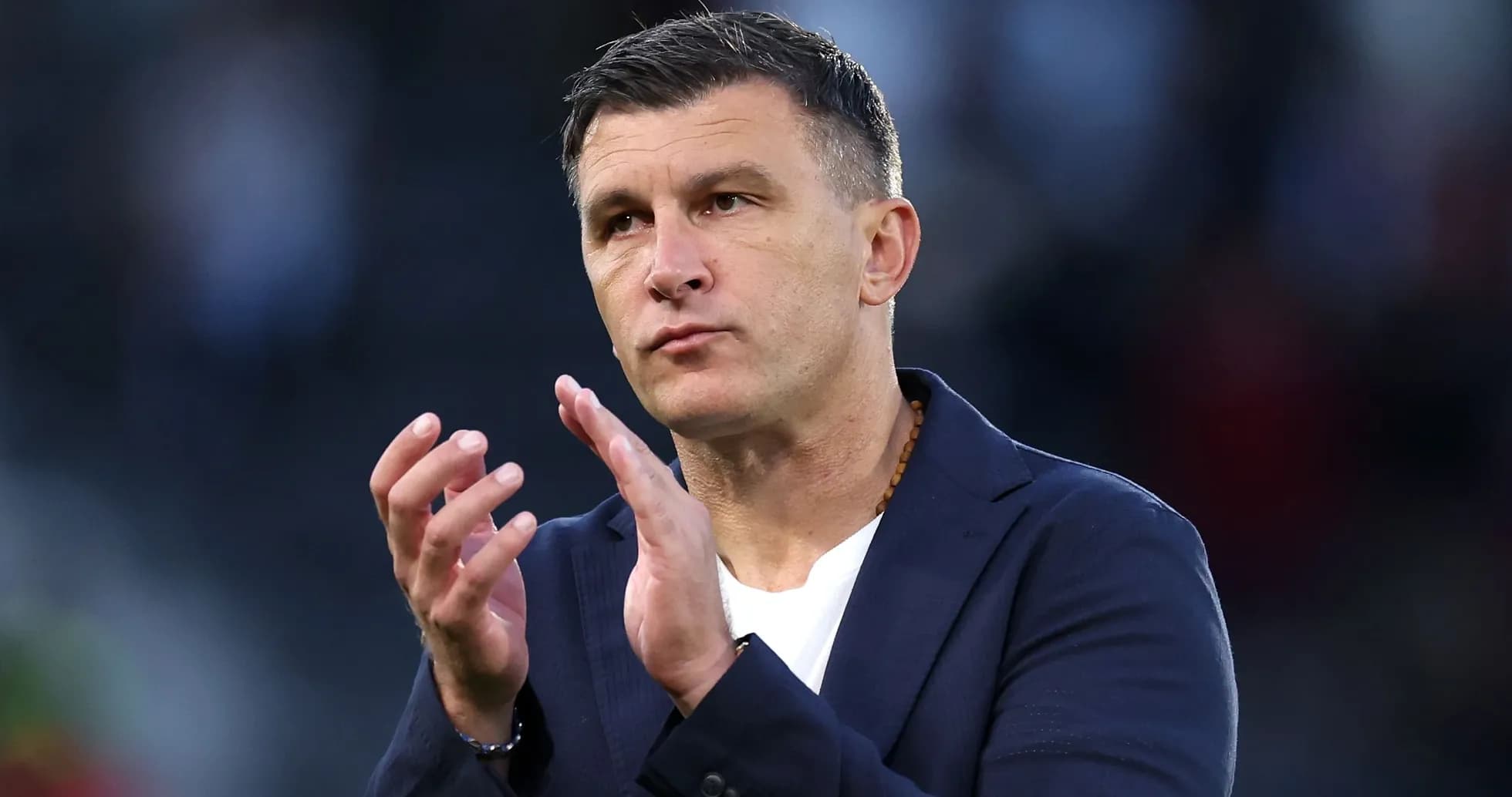 Coach gesturing during a match or event Coach gesturing during a match or event