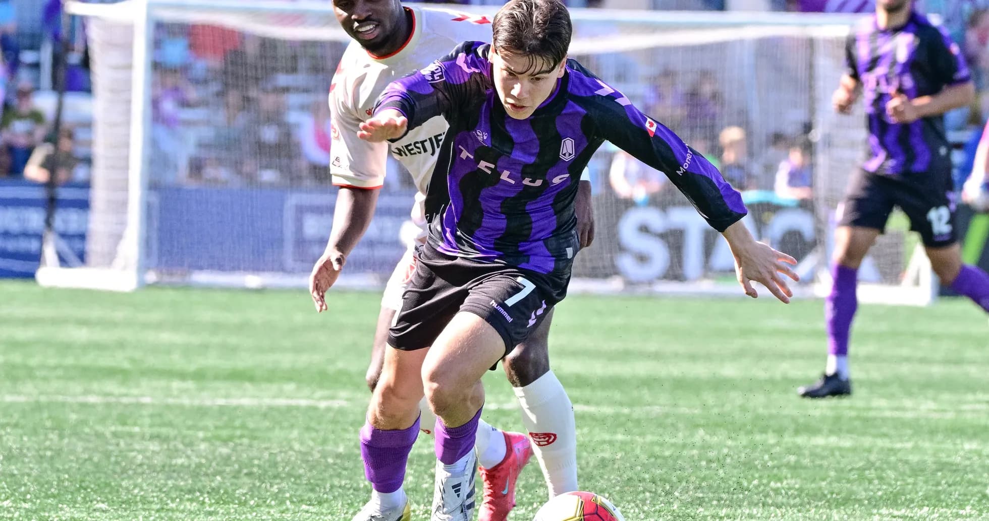 Pacific FC player dribbling during match Pacific FC player dribbling during match