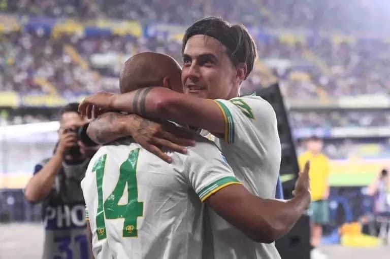 Two players embracing on the field after match Two players embracing on the field after match