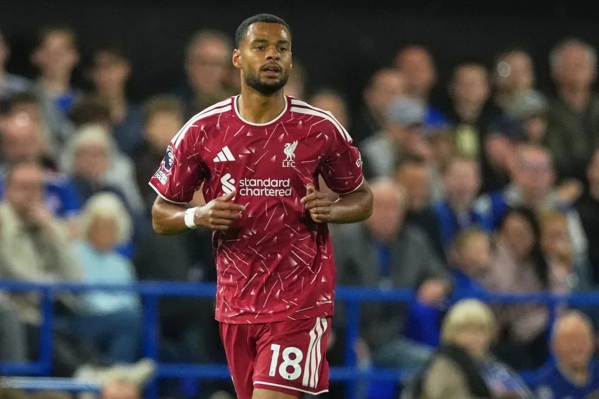 Liverpool player running on the pitch during match Liverpool player running on the pitch during match