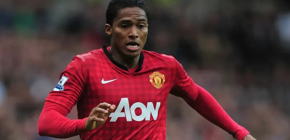 Player running with the ball in Manchester United kit Player running with the ball in Manchester United kit