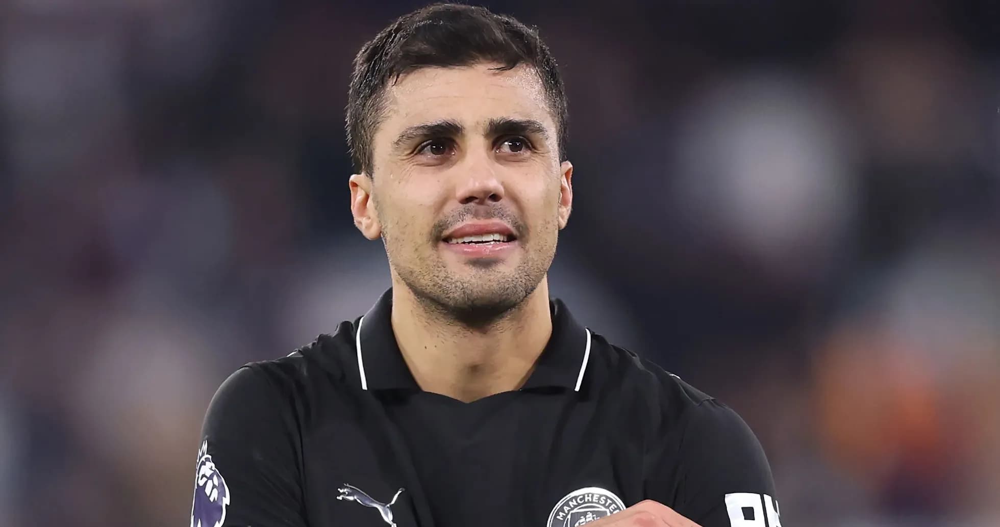 Player in black jersey celebrating on the field Player in black jersey celebrating on the field