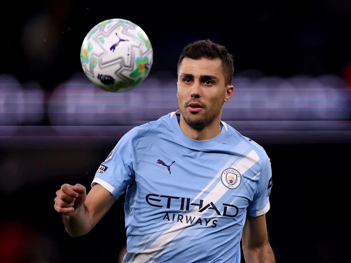 Player in light blue kit controlling a soccer ball Player in light blue kit controlling a soccer ball