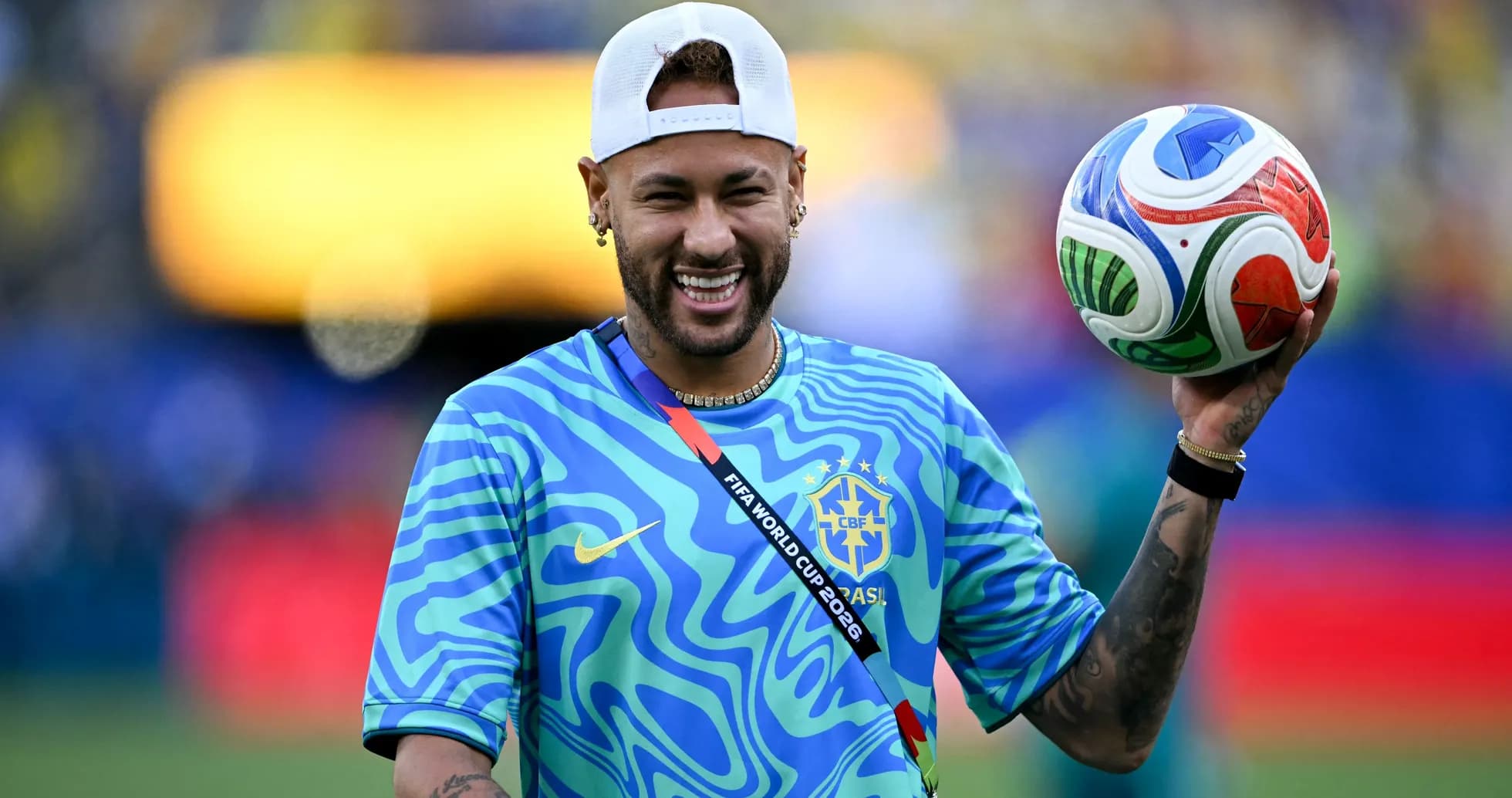 Player holding a soccer ball on the field Player holding a soccer ball on the field