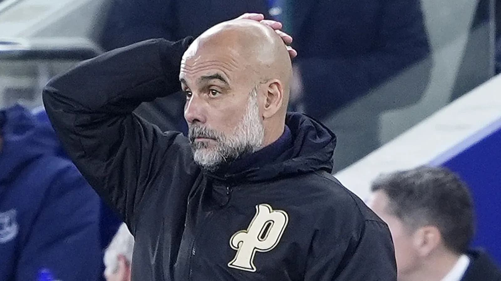 Coach with hand on head during match observation Coach with hand on head during match observation