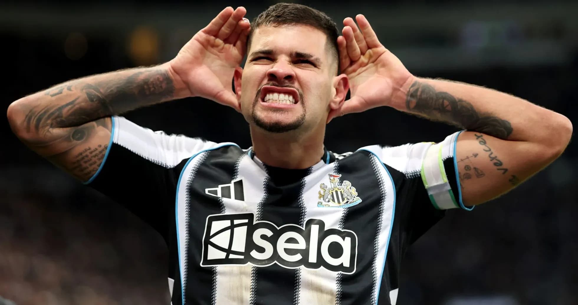 Player celebrating with hands on head at stadium Player celebrating with hands on head at stadium