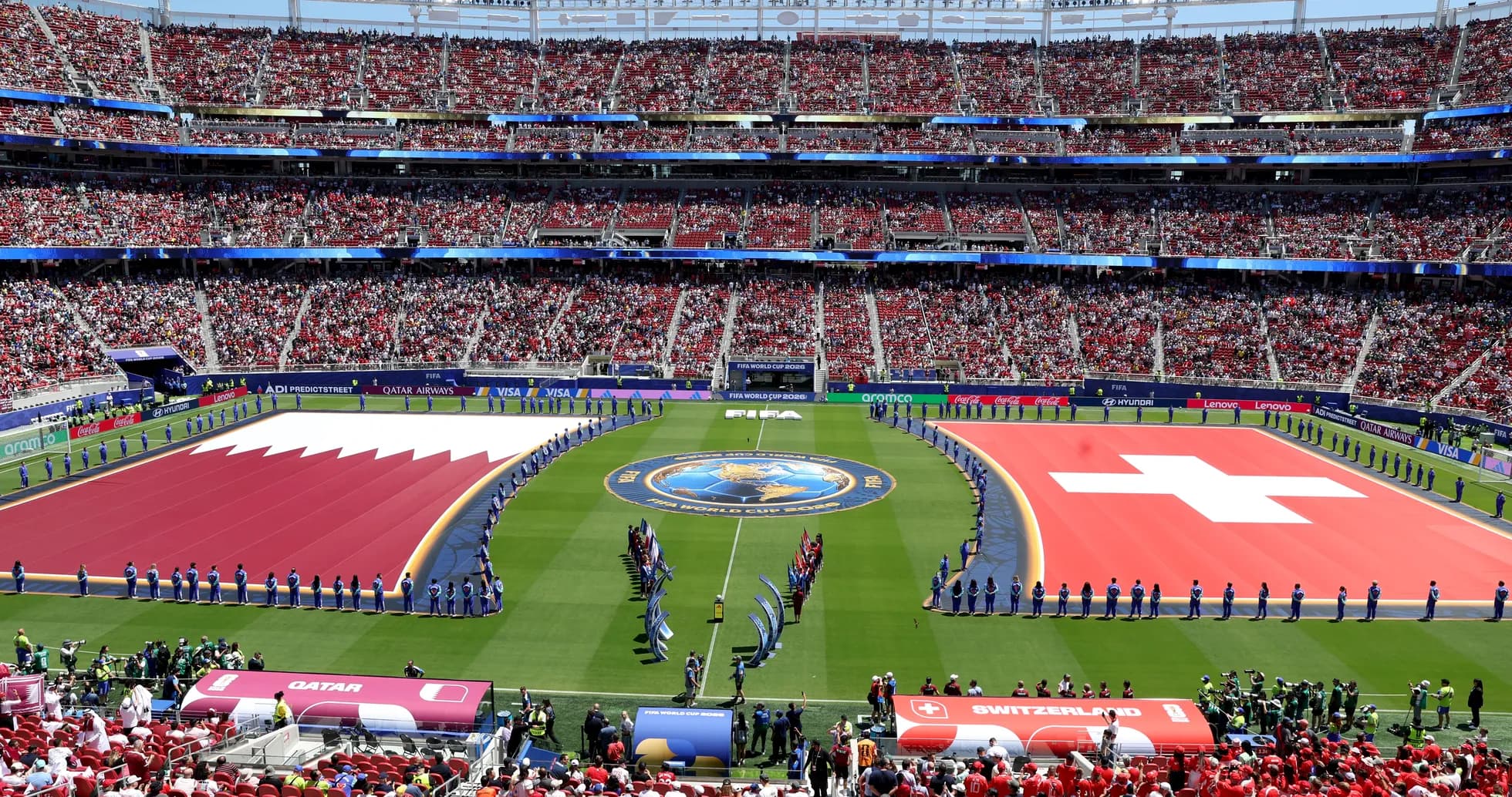 Qatar and Switzerland flags on the field Qatar and Switzerland flags on the field