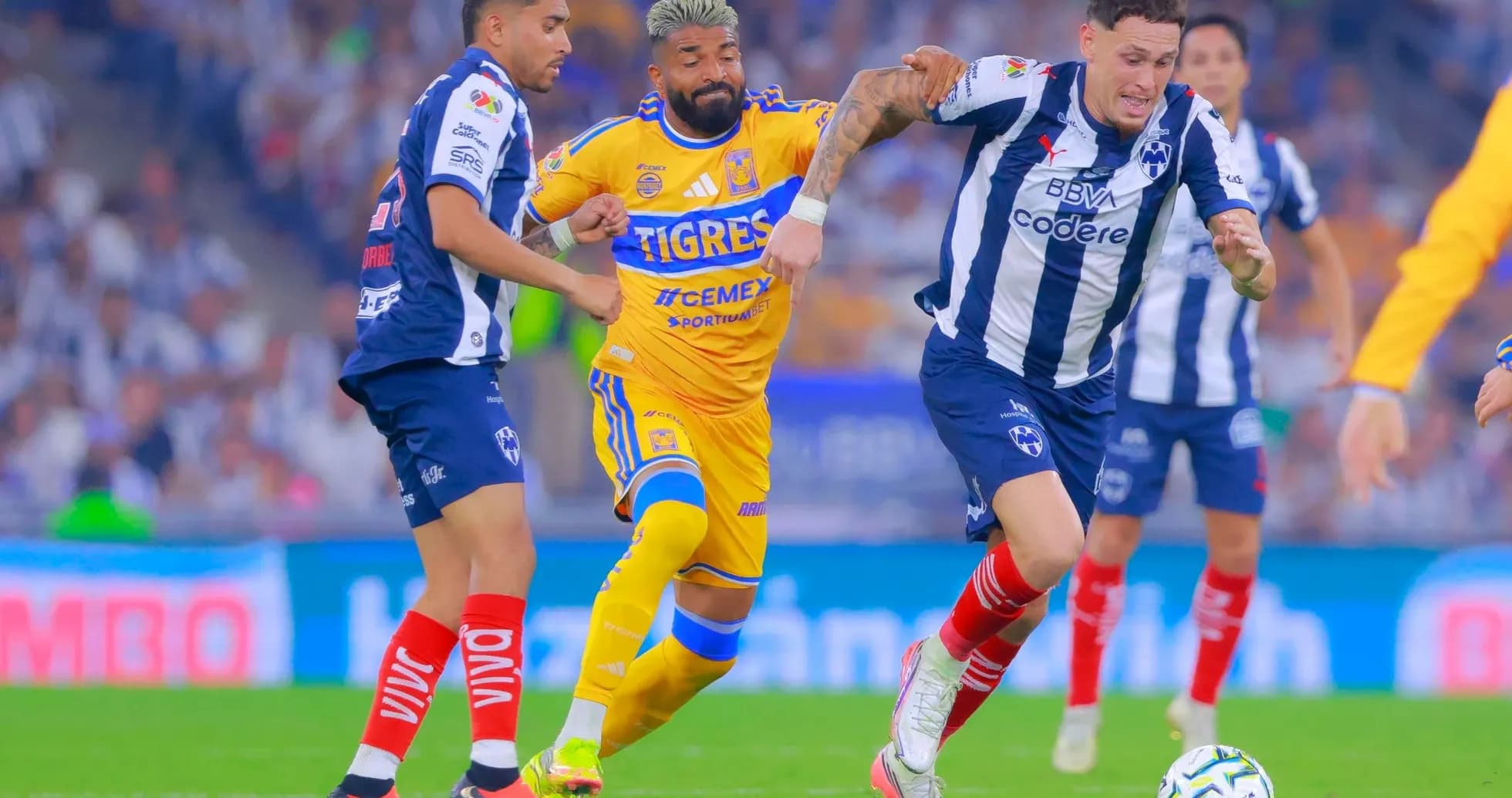 Monterrey players challenging Tigres UANL during match Monterrey players challenging Tigres UANL during match