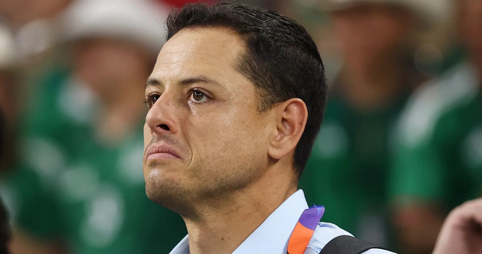 Man with tearful expression in sports venue Man with tearful expression in sports venue