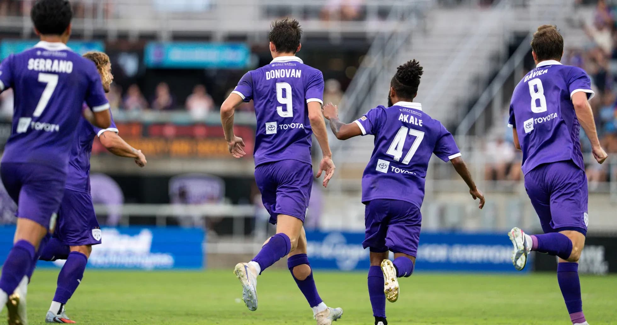 Louisville City players celebrating a goal Louisville City players celebrating a goal