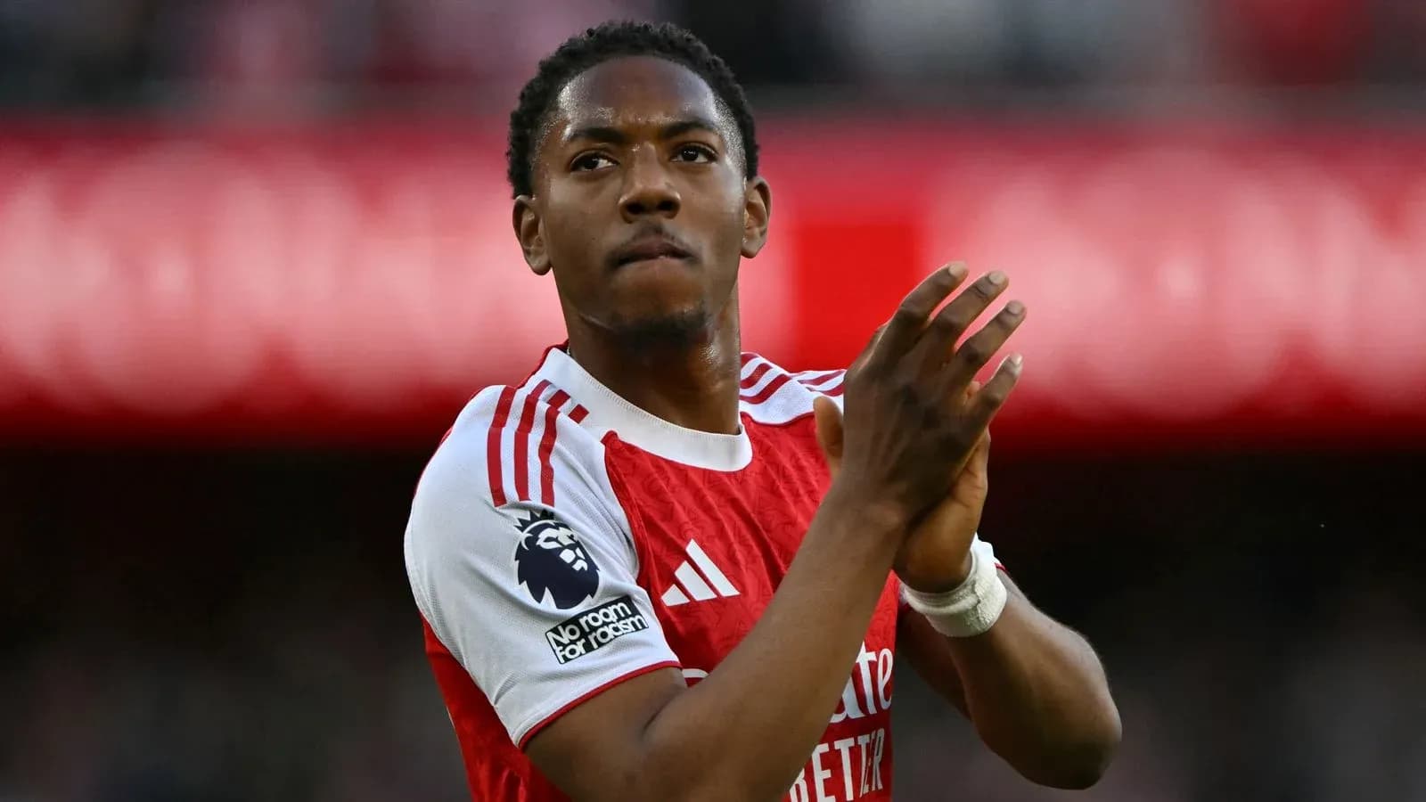 Player applauding fans in Arsenal home kit Player applauding fans in Arsenal home kit